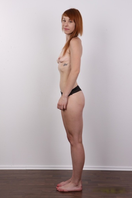 Amateur redhead Nikol gets totally naked before showing her pierced pussy 55215430