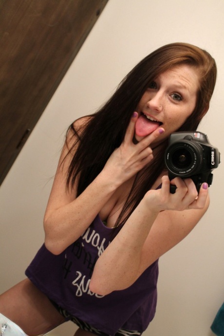 Amateur chick Freckles 18 sticks out her tongue while taking mirror selfies 16512827