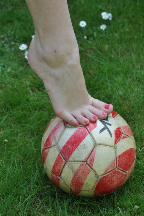 British woman Piage Turnah licks and sucks her own toes on the lawn 13271397