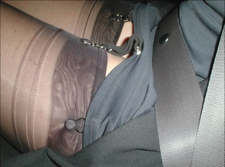 Mature woman Nylon Jane exposes her garters during upskirt action at night 88912213