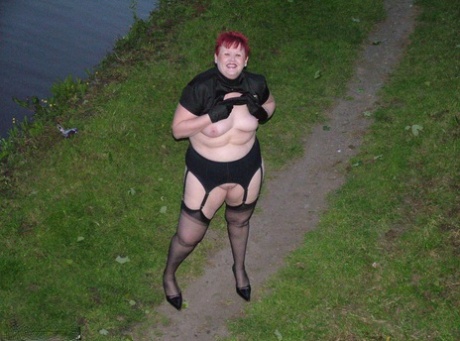 Mature redheaded woman Valgasmic Exposed exposes herself while out in public 80036950