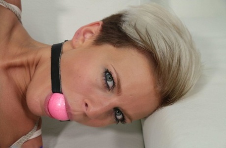 Solo girl with short hair is hogtied and ballgagged in her underwear and heels 40335123