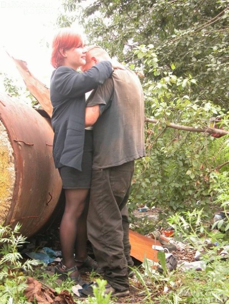 Horny older woman with red hair fucks 3 homeless men at their camp in woods 20559028
