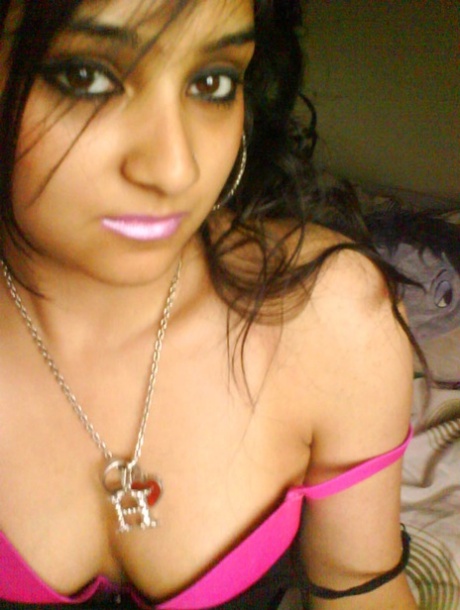 Pretty Indian girl exposes a bare shoulder during self shot action 70291218