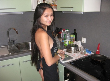 Young Asian girl partakes in POV sex while in her kitchen 14413631