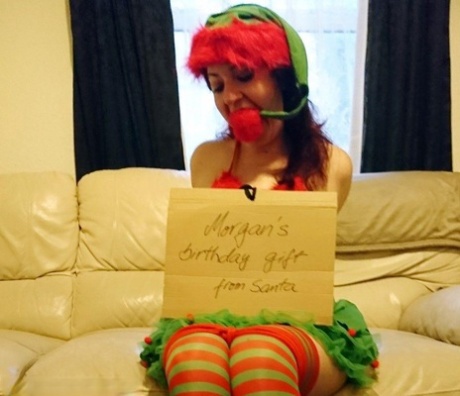 Redheaded girl is gagged and hogtied in a cute Xmas outfit 47764954