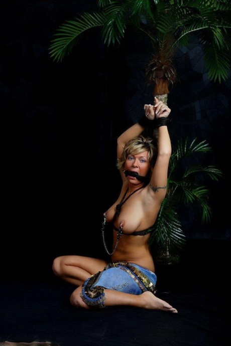 Busty blonde with a pierced nipple works free of cleave gag and cuffed hands 76404796