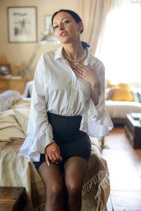 Amateur model exposes her beautiful tits as she removes business attire 60685440