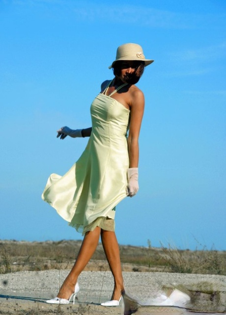 Classy lady takes off her dress while going topless outdoors in vintage nylons 67769735