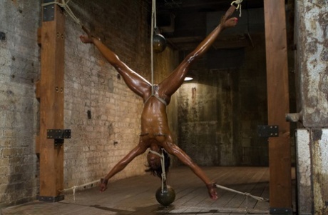 Restrained black girl is punished and masturbated by a Caucasian dyke 26188499