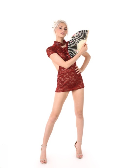 Platinum blonde Christy White wields an oriental fan before stripping 83656107