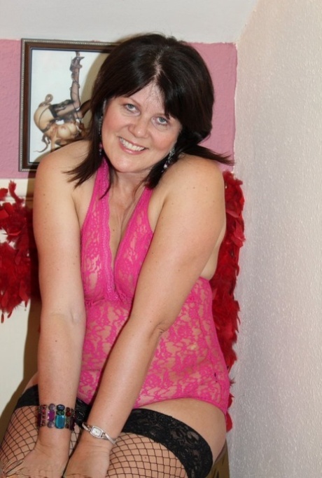 Mature brunette Cassandra Uk masturbates with a vibrator in mesh stockings 51044999