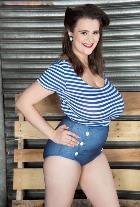 Solo model Tiggle Bitties puts her knockers on display upon a ladder 27752170