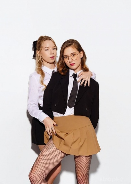 Schoolgirls Muna and Mirka have strapon lesbian sex upon a bed 89040332