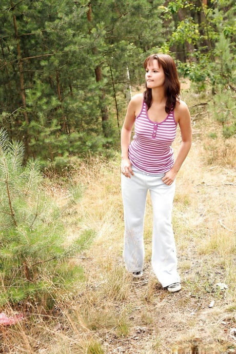 European teenager Rita E revealing nice tits while masturbating in the woods 75031228